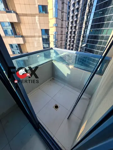 Luxury 1BR apartment with spacious layout for annual rent in Falcon Towers Ajman, 2 bathrooms, balcony, parking, prime location near all services.