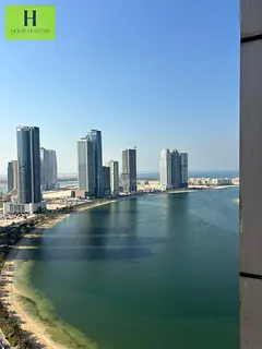 Elegant 1 Bedroom Apartment Near Corniche with Partial Sea View | Access to Gym, Pool &amp; Parking 