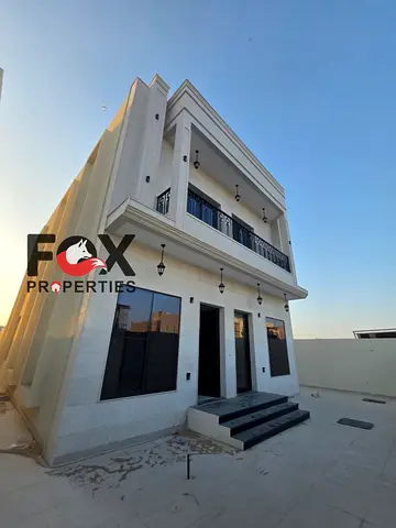 Modern luxury villa for sale in Ajman, never occupied, 5 master bedrooms, spacious majlis and hall, large layout, land area 3014 sqft.