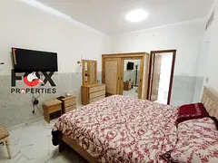 Two rooms and a living room for annual rent in Al Waha Towers in Rashidiya 1 area. Gym, swimming poo