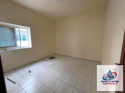 For annual rent: a two-bedroom apartment with a living room and two bathrooms, featuring luxurious finishing, a spacious and fully equipped kitchen wi
