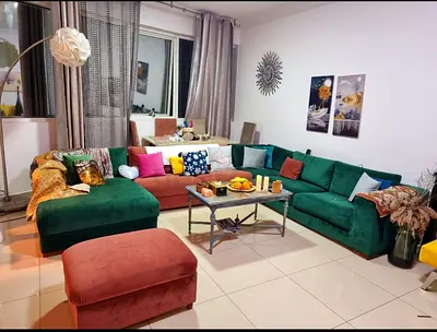 Large Green Velvet L-Shaped Corner Sofa with Ottoman — Good Condition
