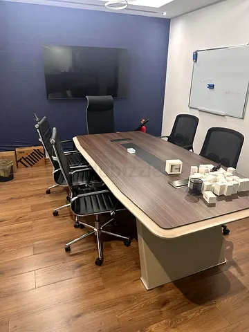 Premium executive boardroom meeting table available from a modern corporate office setup.  AED4,500