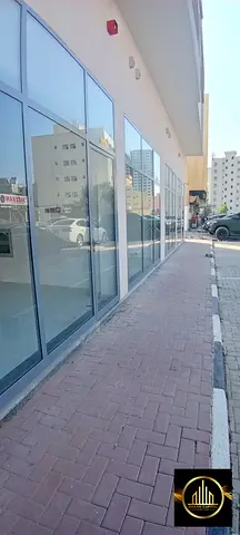 Shops for annual rent, first occupancy building in Al Karama area, Ajman