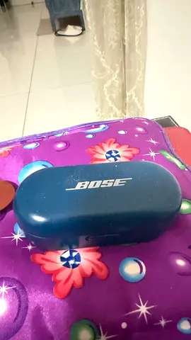 Bose wireless earbuds and  charging case (blue) for sale.