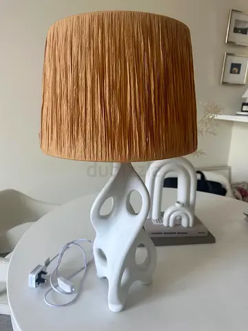 Modern sculptural table lamp with textured shade