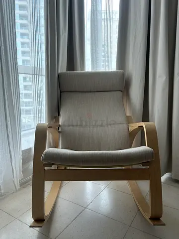 Light Wood Rocking Lounge Chair with Beige Cushions