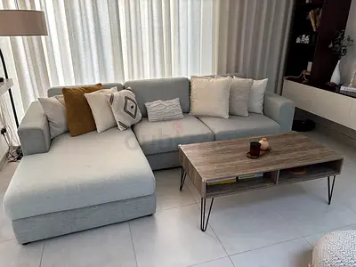 Light grey L-shaped sectional sofa with chaise — good condition