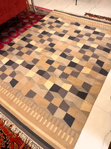 Used geometric patterned area hand made  rug - beige, cream and grey tones