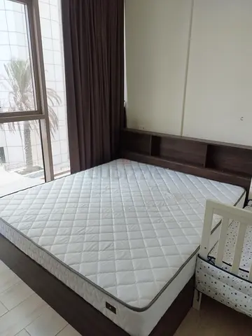 Bed and cot with side table