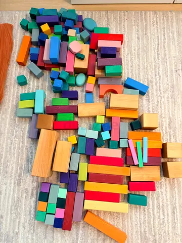 Set of colorful wooden building blocks — mixed shapes, used. Grimms blocks - from large pyramid