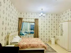 A distinctive studio apartment in the Orient Towers is for sale, featuring a gym, swimming pool, and