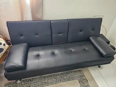 Black faux leather 3-seater sofa bed with chrome legs