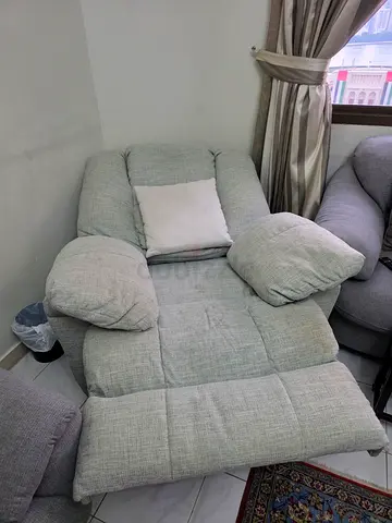 Electrical Light grey single-seater recliner/armchair in good used condition