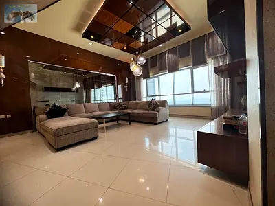Annual rent in Ajman: super deluxe duplex on the Corniche with direct sea view, in a tower with pool and parking, close to all services.