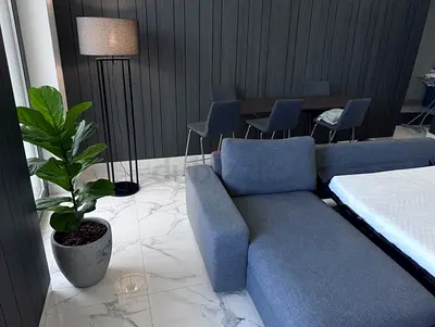 Pull out gunnared dark Sofa bed with mattress