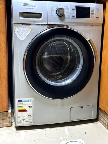Front-load washing machine (used) - 7kg, stainless steel