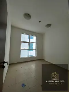 Two-bedroom apartment with a living room for annual rent in City Tower Al Nuaimiya 2, featuring a cl