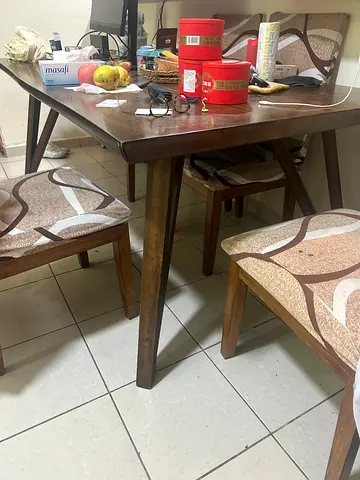 Wooden dining table with 6 upholstered chairs - good condition