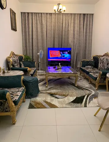 Classic carved sofa set with center table and modern rug - good condition