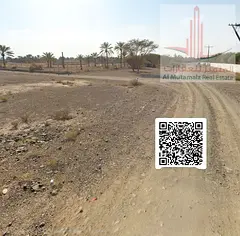Residential land for sale in Masfout area, plot 3, on the main road, prime location