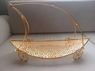 Gold decorative serving/fruit tray on wheels — used, good condition