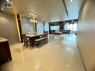 3BR furnished apartment for annual rent in Corniche Tower, Ajman, direct sea view on Ajman Corniche, spacious, 2 balconies, parking, gym & pool.