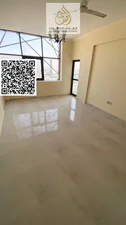 Two bedrooms and a separate living room with a gym, swimming pool, and parking in Al Jurf 2. Large a