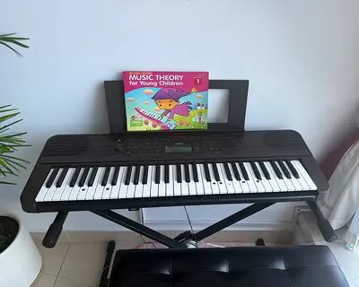 High end Yamaha Electronic Keyboard with Stand, stool with box, piano Music theory lesson book 1,2 a