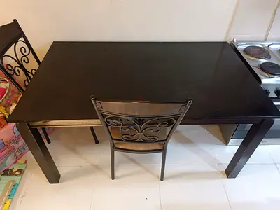 IKEA dark wood dining table - seats 4, sturdy rectangular with 4 chairs in great condition.