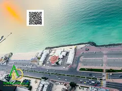 Two rooms and a hall with a maid’s room directly overlooking the sea in Ajman Corniche Towers, wit