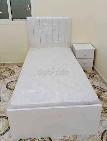 Single White Bed Frame with Mattress and Nightstand