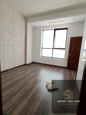 A room and lounge with a practical design and comfortable space in a strategic location near Al-Aqsa School, within a vibrant area that provides
