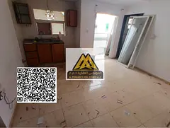 A studio for annual rent in Al Nuaimiya 2 – Ajman, featuring a balcony and a comfortable layout in