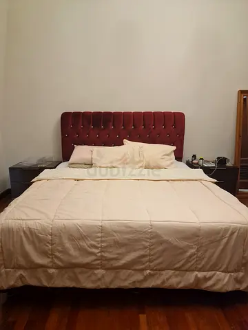 Queen bed with upholstered headboard (burgundy) - good condition. Plus mattress. Incredible quality.