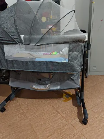 Lightly Used Baby Bassinet/Cradle with Mosquito Net and Storage