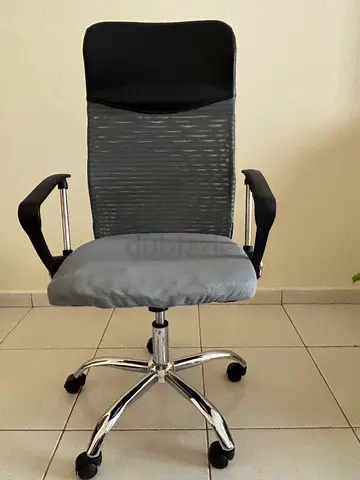 Gray Rotating Office Chair with Headrest and Armrests