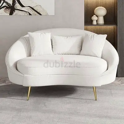 Two-seater curved white boucle sofa with gold legs