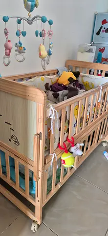 Solid Wood Baby Crib with Mobile and Bumper - Good Condition