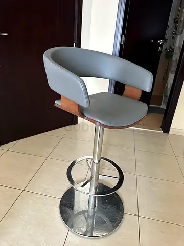 Bar Stool with real leather and swivel mechanism. I have 2 of them and price is 100 aed each