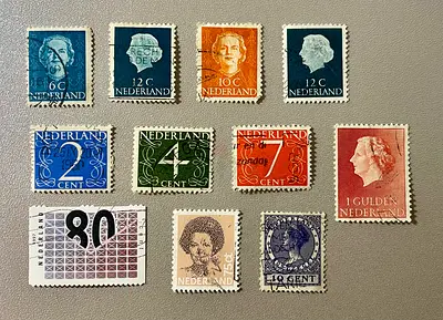 11 VINTAGE POSTAGE STAMPS OF NEDERLANDS