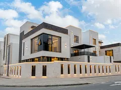 Corner villa (with pool and elevator) for sale in Ajman | Al Helio 2 area | 6 bedrooms, majlis, 2 li
