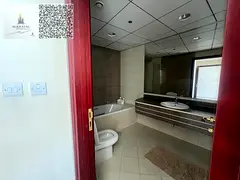 For annual rent in Ajman, Corniche Residence Towers, city view, two-bedroom apartment with a living