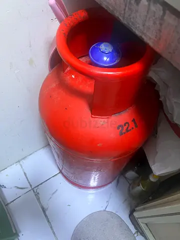 Gas cylinder with regulator and half of Gas. Light used