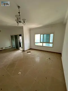 Beautiful two-bedroom apartment with a living room on Ajman Corniche, plus a maid's room, four b