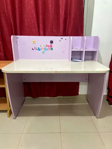 Light purple wooden study desk with shelves — good condition