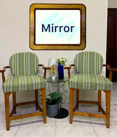 Pair of striped wooden bar stools with padded seats  mirror