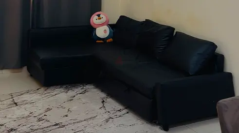 Black L-shaped Sofa with Storage —