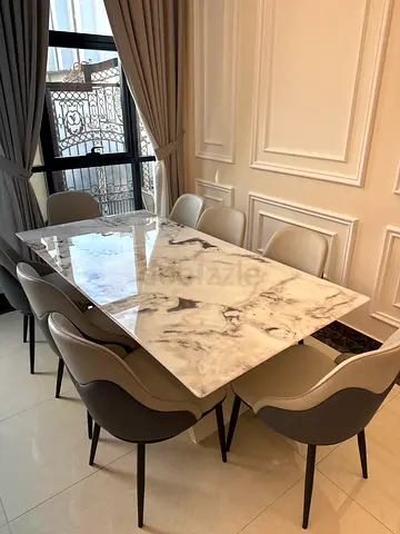 Marble-top dining table with 8 modern chairs