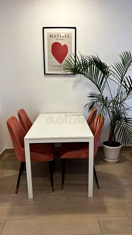 Compact white dining table with 4 pink velvet chairs - used, very good condition